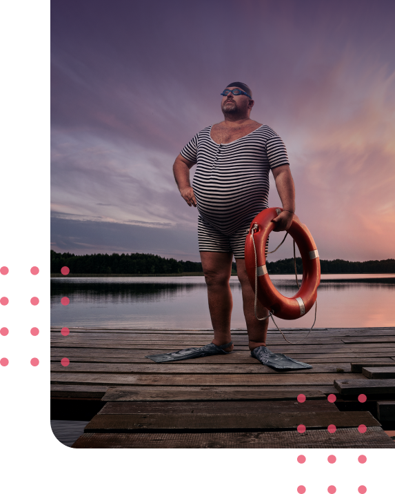 man near a lake with a lifebuoy